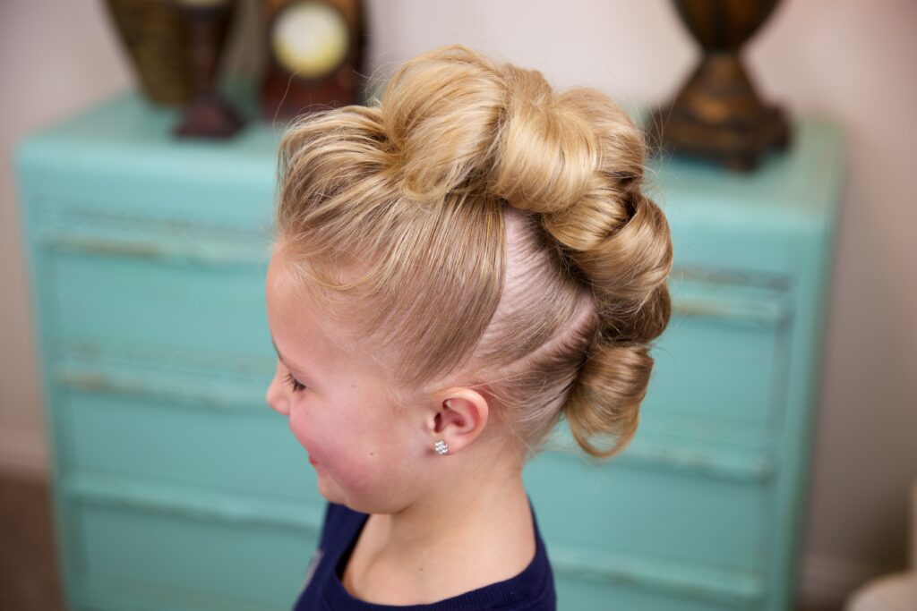 Little girl indoors Flower Bun Hawk | Hairstyles for Dance