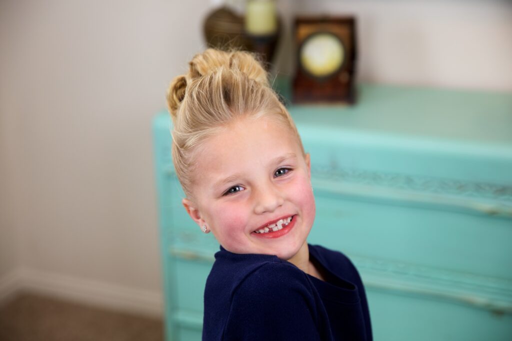 Little girl indoors Flower Bun Hawk | Hairstyles for Dance