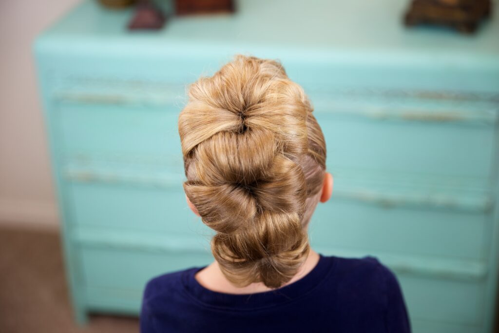 Little girl indoors Flower Bun Hawk | Hairstyles for Dance (Back)