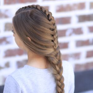 Young girl standing outside modeling Peek-a-Boo Tuxedo Braid