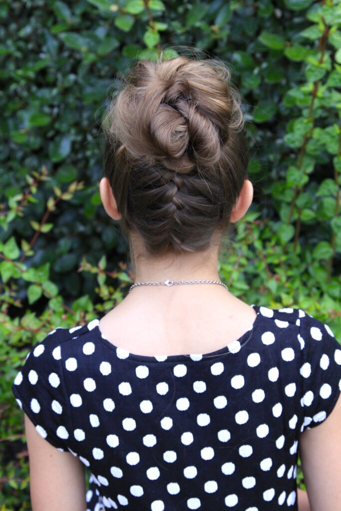 Young girl outside modeling Double-French Messy Bun Updo (Back)