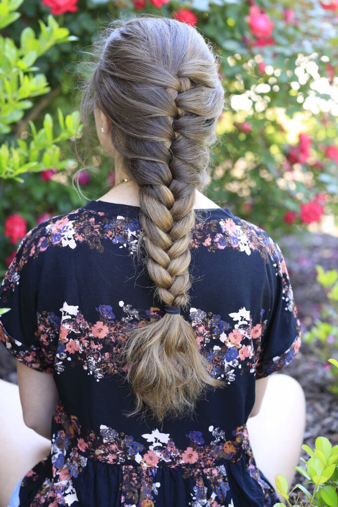 Young girl outside modeling Faux French Braid (Back)