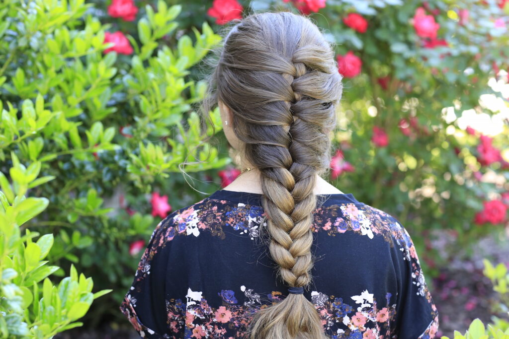 Young girl outside modeling Faux French Braid (Back)