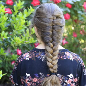 Young girl outside modeling Faux French Braid (Back)