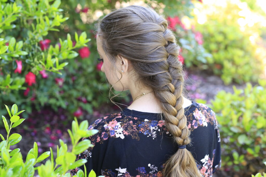 Young girl outside modeling Faux French Braid