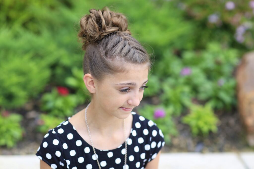 Young girl outside modeling Double-French Messy Bun Updo