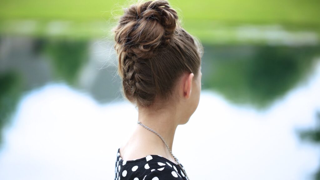 Young girl outside modeling Double-French Messy Bun Updo