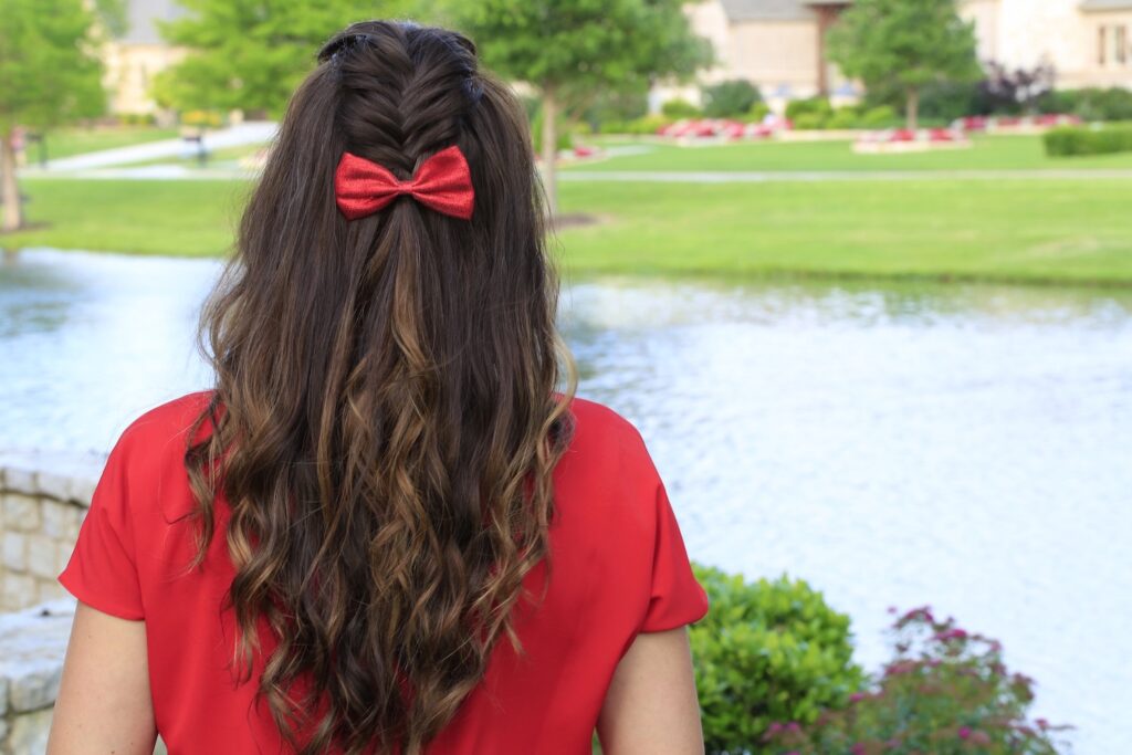 Woman outside with a red shirt modeling Woven Faux Hawk | Edgy Hairstyles