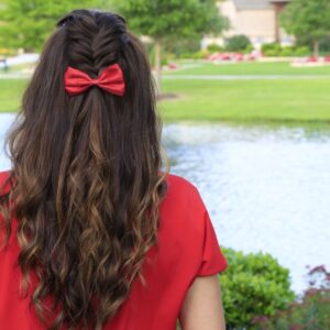 Woman outside with a red shirt modeling Woven Faux Hawk | Edgy Hairstyles