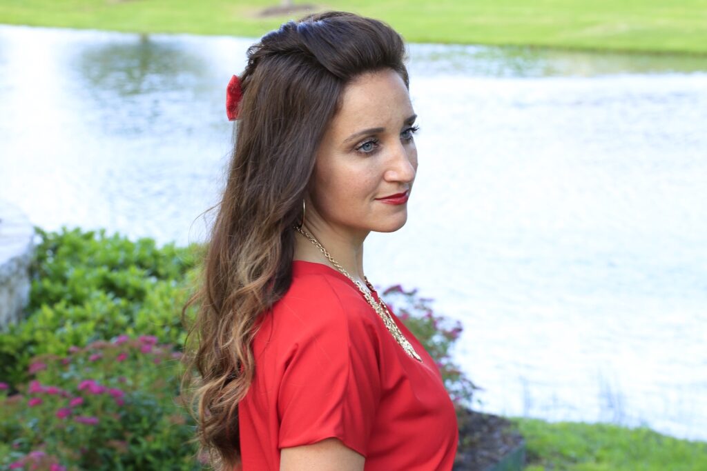 Woman outside with a red shirt modeling Woven Faux Hawk | Edgy Hairstyles