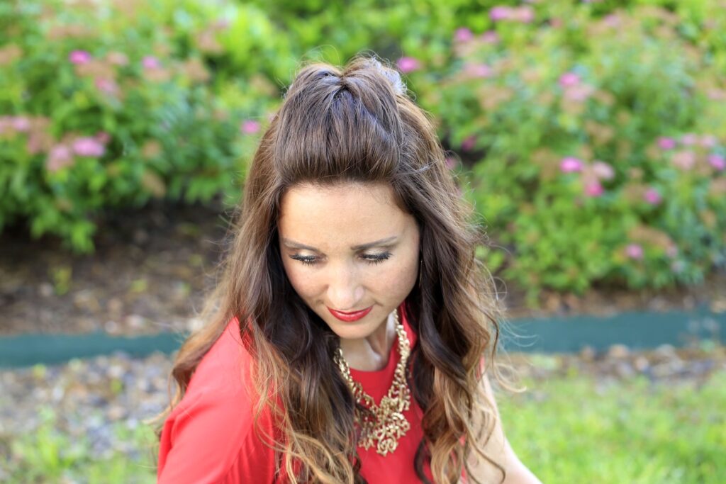 Woman outside with a red shirt modeling Woven Faux Hawk | Edgy Hairstyles