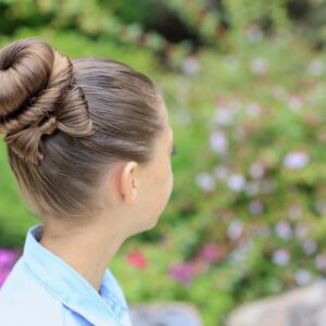 Young girl outside modeling Bow Bun Updo (Back)