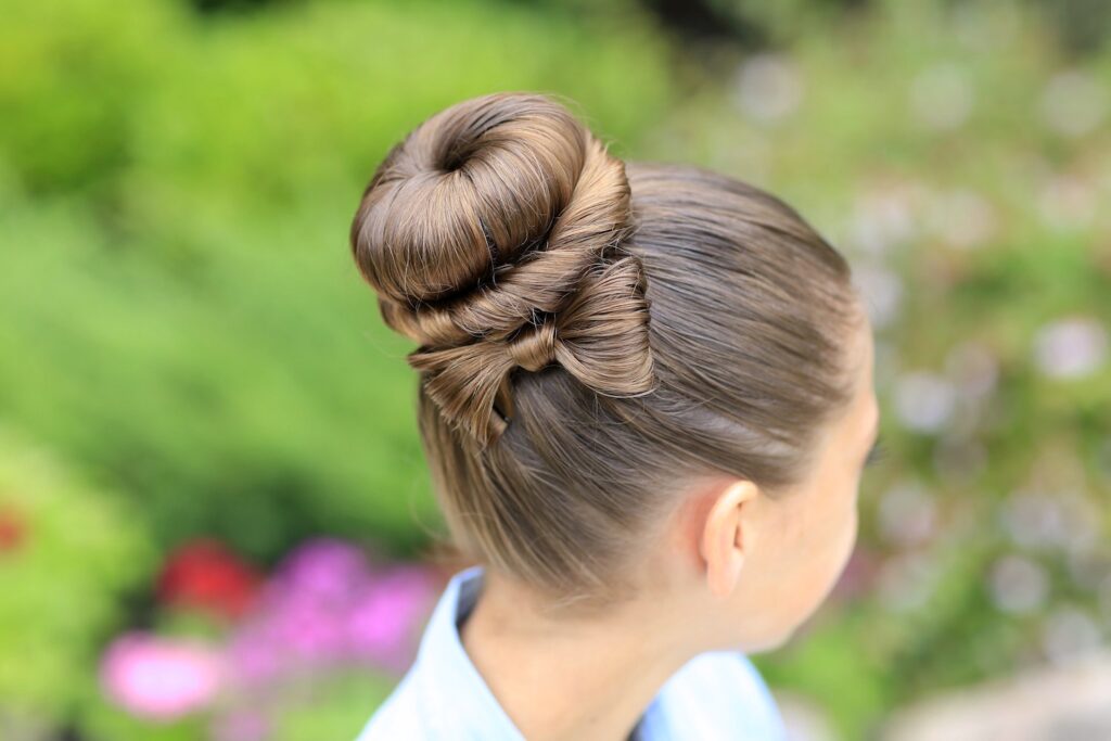 Young girl outside modeling Bow Bun Updo (Back)