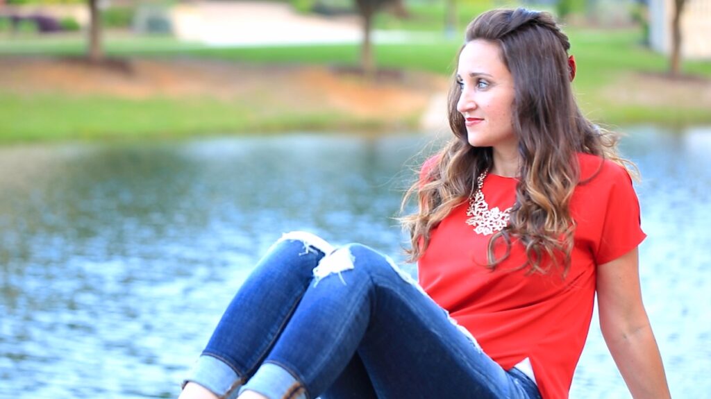 Woman outside with a red shirt modeling Woven Faux Hawk | Edgy Hairstyles