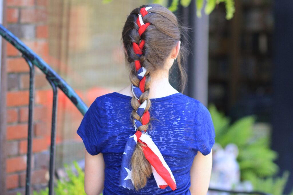 Young girl outside modeling 3-Minute Scarf Braid | 4th of July Hairstyles