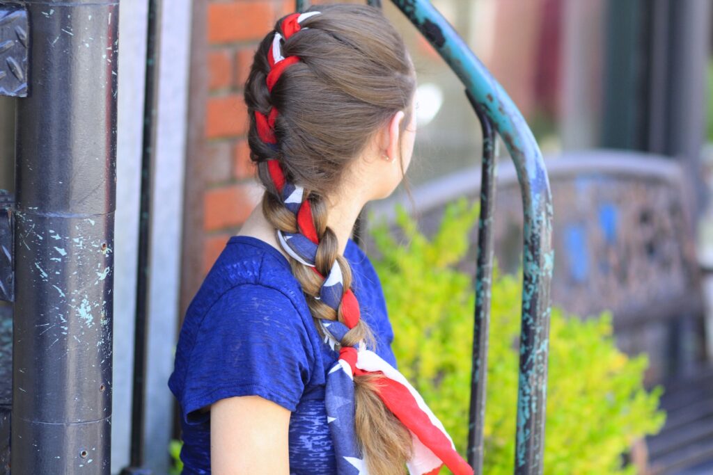 Young girl outside modeling 3-Minute Scarf Braid | 4th of July Hairstyles