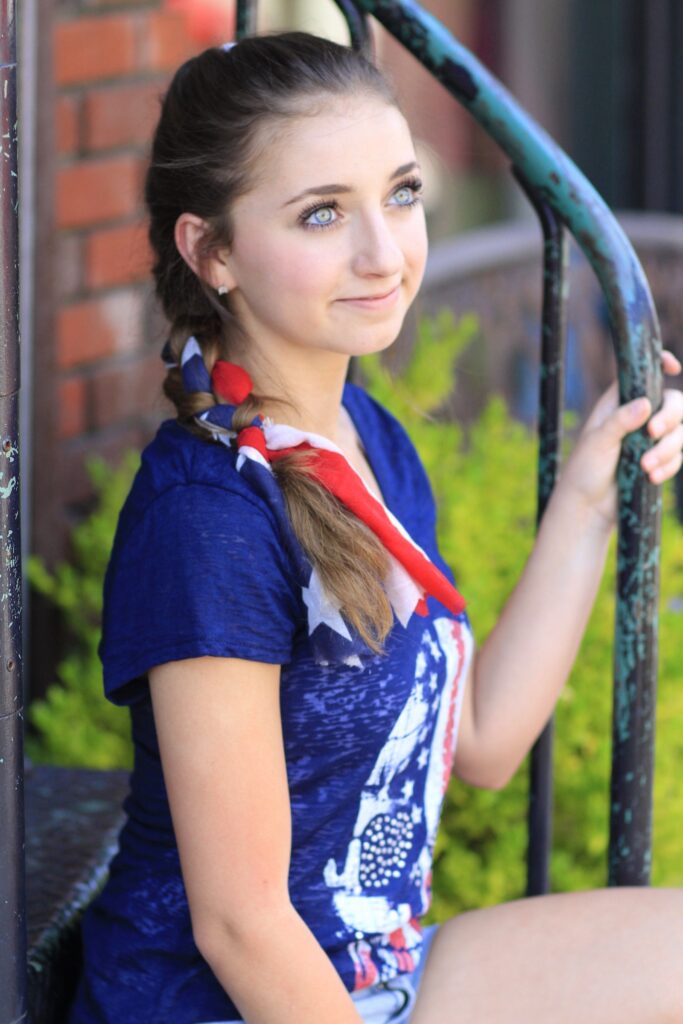 Young girl outside modeling 3-Minute Scarf Braid | 4th of July Hairstyles