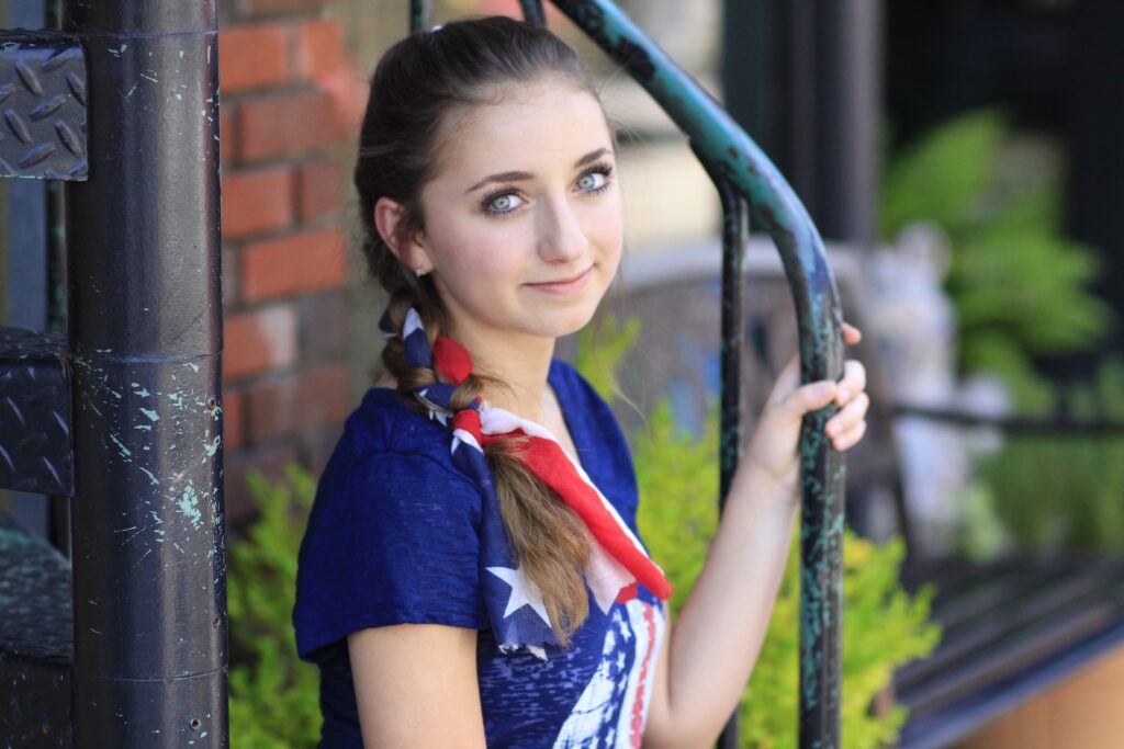 Young girl outside modeling 3-Minute Scarf Braid | 4th of July Hairstyles