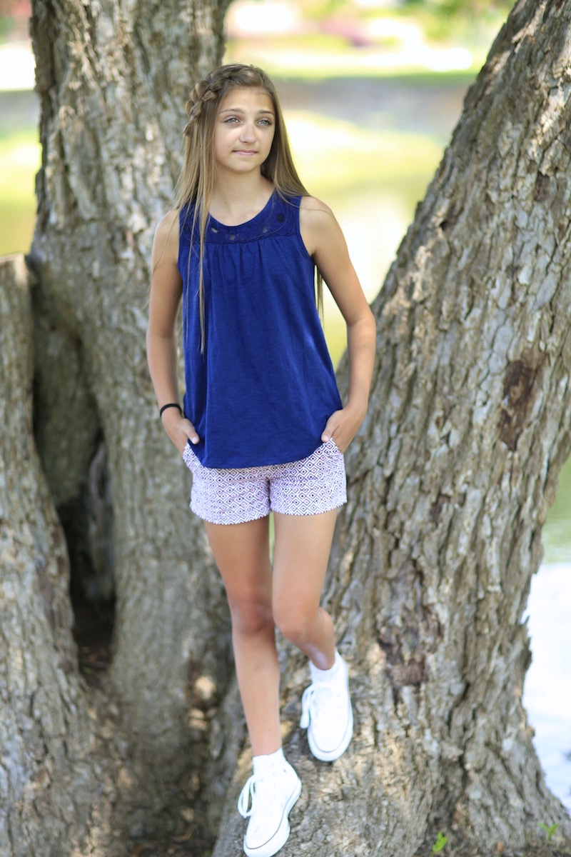 Young girl outside modeling Rick Rack Braid