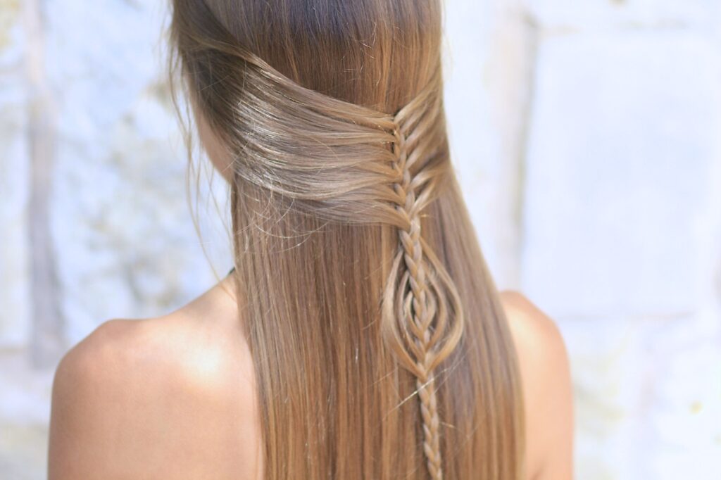 Young girl outside modeling Mermaid Braid Combo