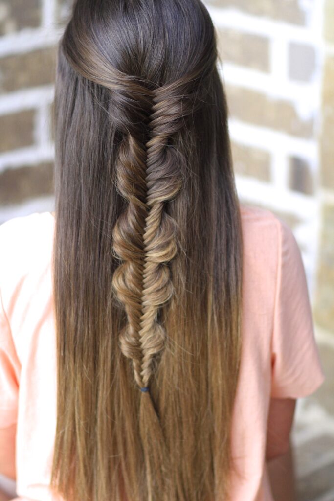 Young girl with long hair modeling Bubble Fishtail Braid