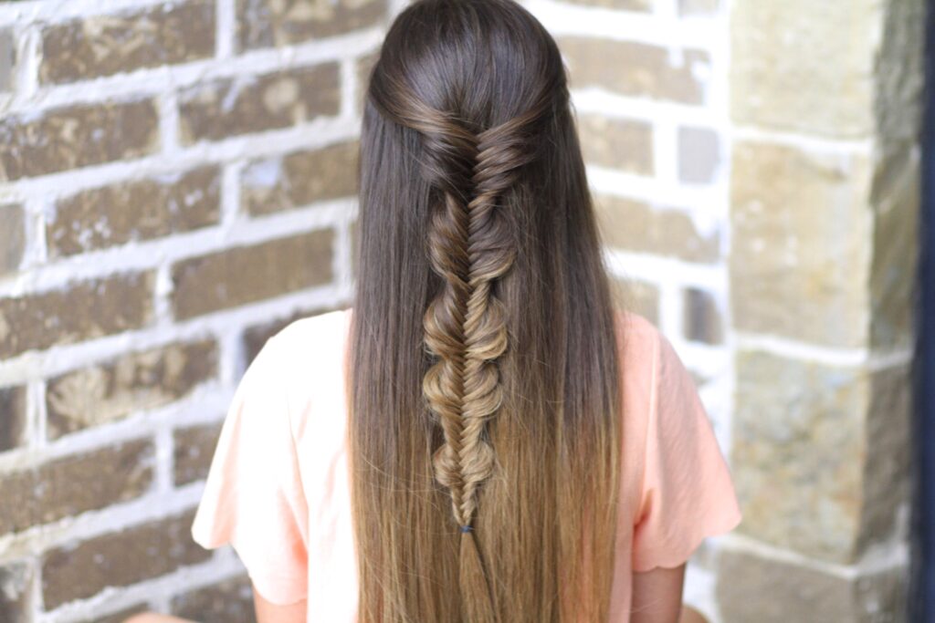 Young girl with long hair modeling Bubble Fishtail Braid