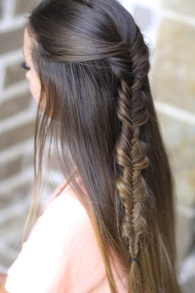 Young girl with long hair modeling Bubble Fishtail Braid