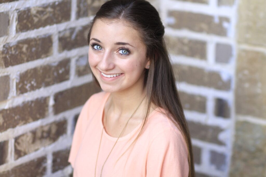 Young girl with long hair modeling Bubble Fishtail Braid