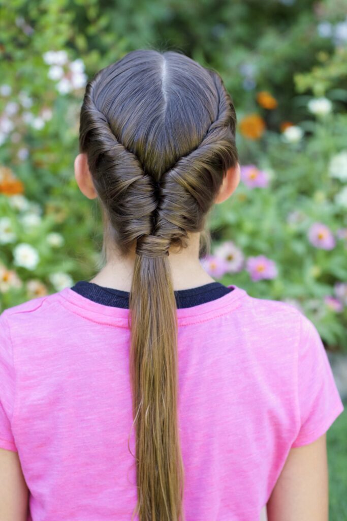 Young girls outside modeling Tornado Twist hairstyle (back)