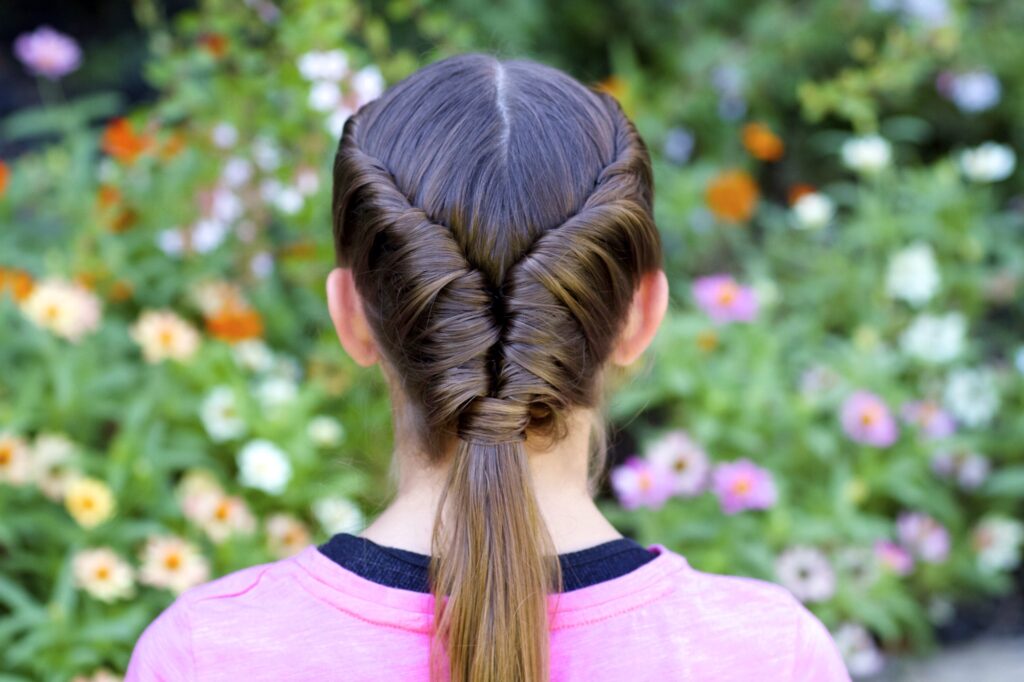 Young girls outside modeling Tornado Twist hairstyle (back)