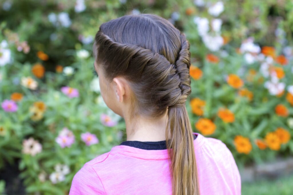 Young girls outside modeling Tornado Twist hairstyle