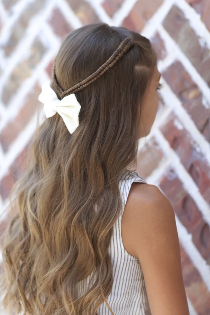 Young girl outside modeling Infinity Braid Tieback | Back-to-School Hairstyles