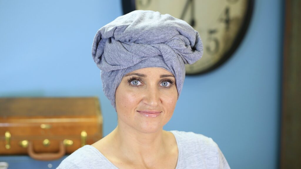 Portrait of woman with her hair wrap in a towel