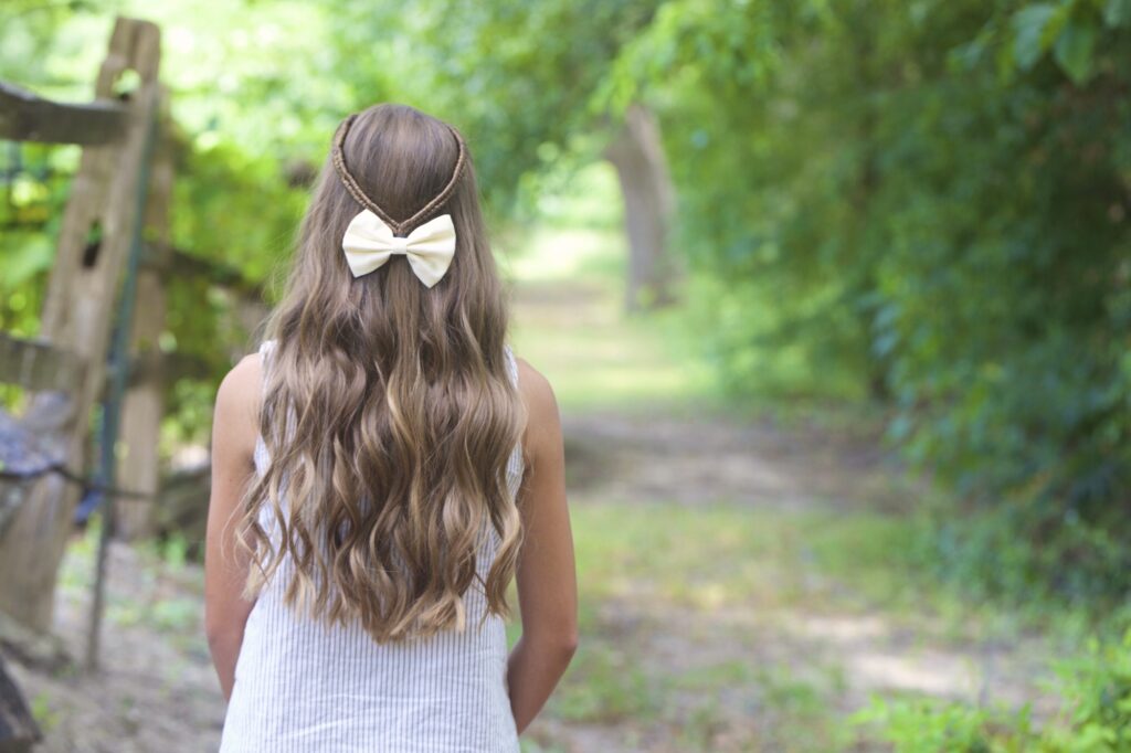 Young girl outside modeling Infinity Braid Tieback | Back-to-School Hairstyles