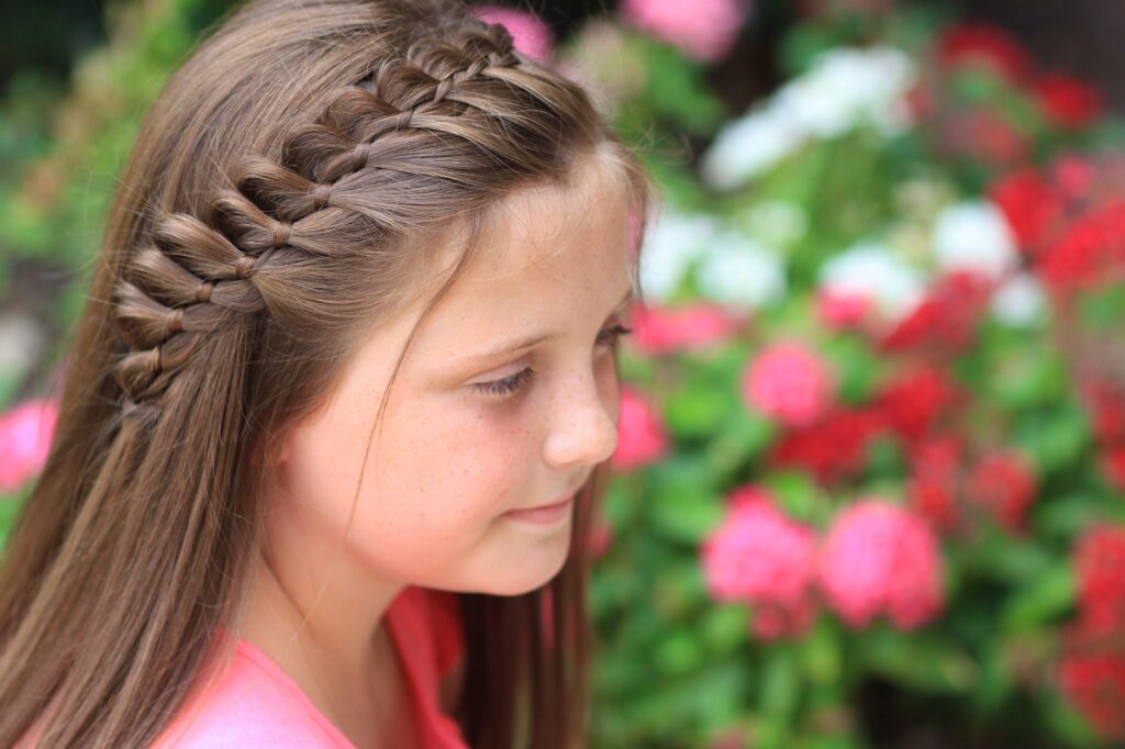 Young girl outside modeling 4-Strand French Braid | Easy Hairstyles