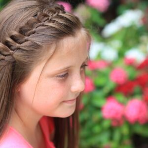 Young girl outside modeling 4-Strand French Braid | Easy Hairstyles