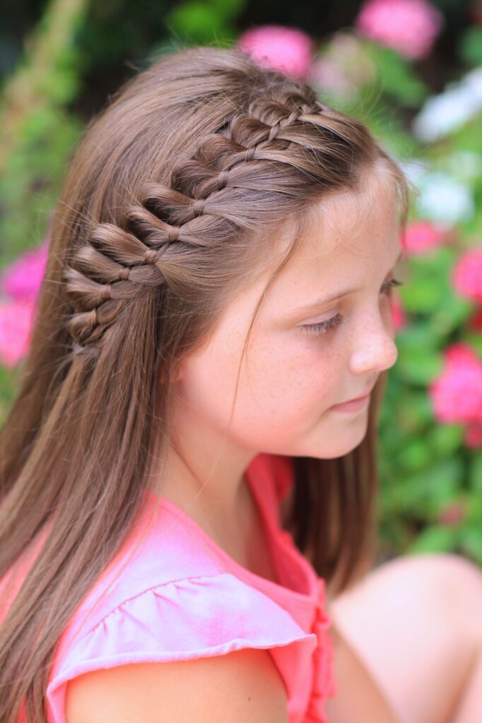 Young girl outside modeling 4-Strand French Braid | Easy Hairstyles