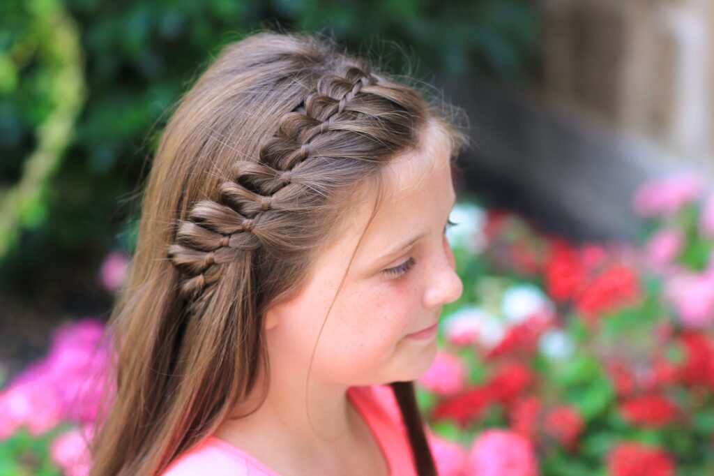 Young girl outside modeling 4-Strand French Braid | Easy Hairstyles
