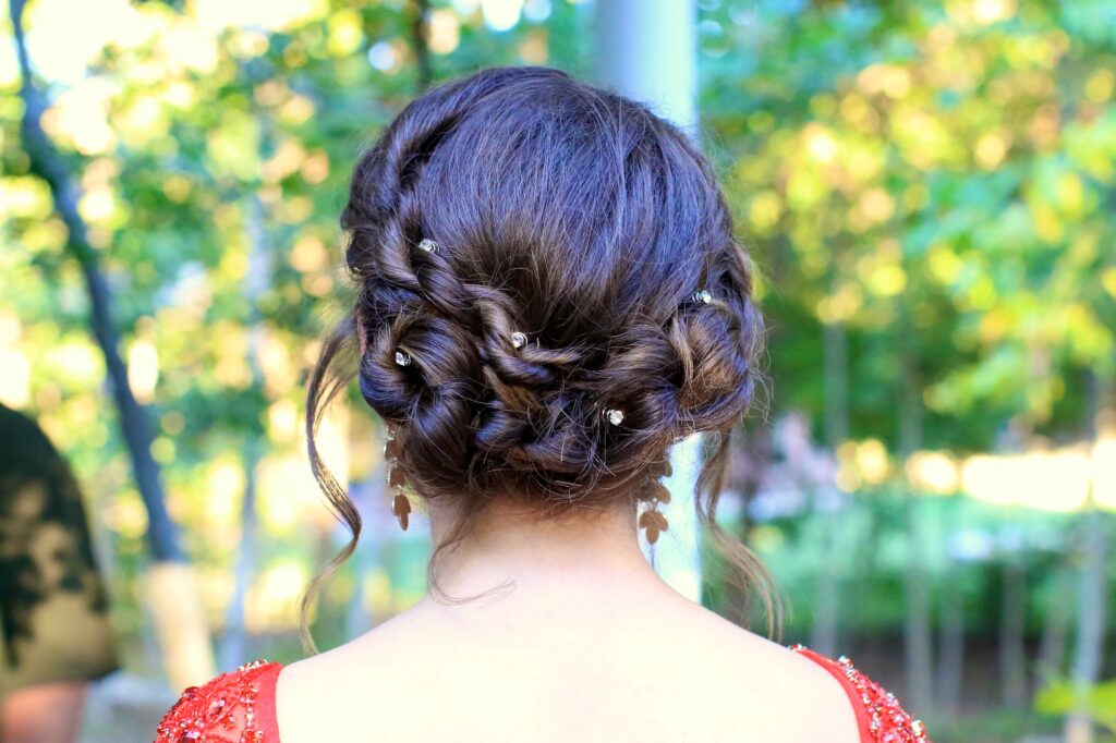 Young girl outside modeling Rope Twist Updo | Homecoming Hairstyles