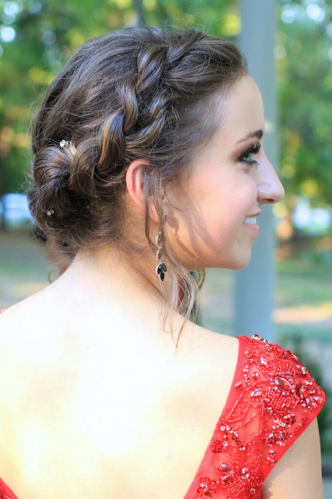 Young girl outside modeling Rope Twist Updo | Homecoming Hairstyles