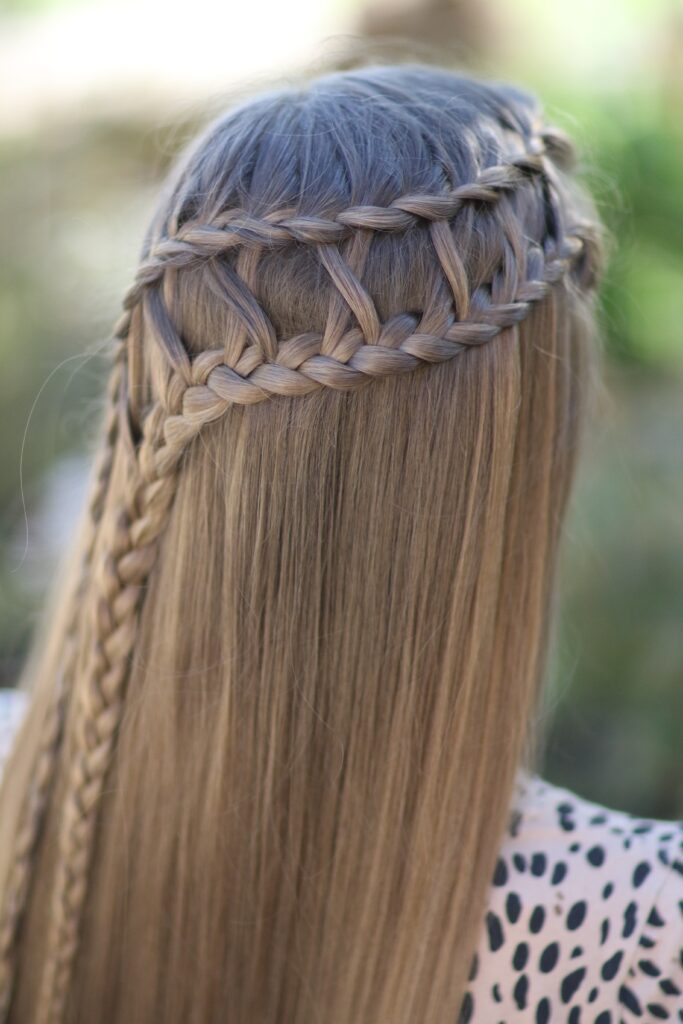 Young girl outside modeling Lattice Braid Combo (back)