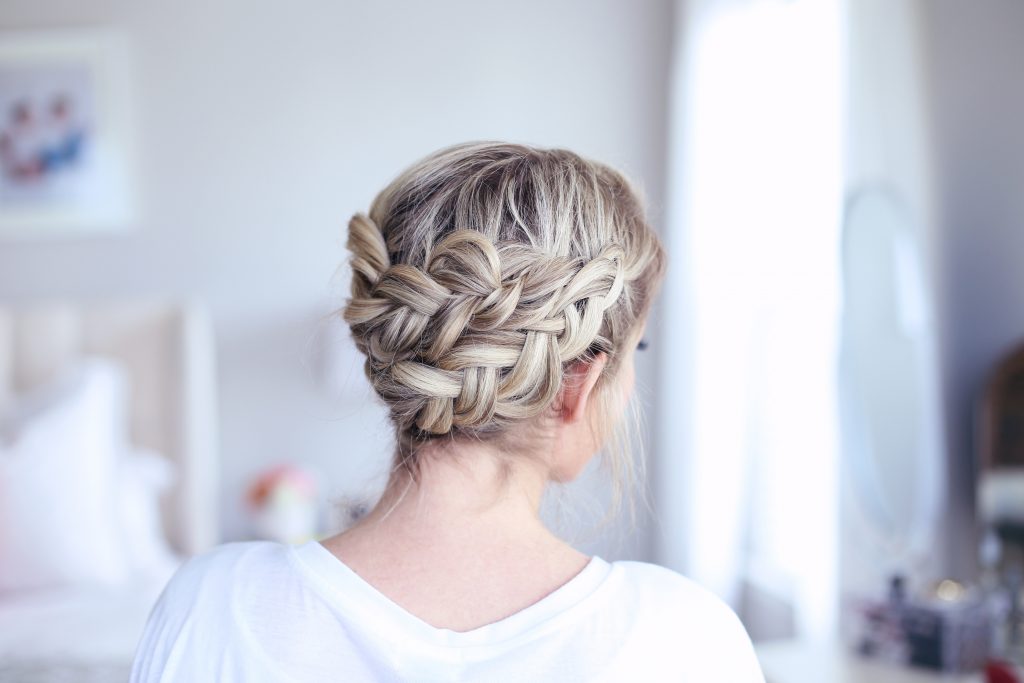 Back view of young women standing in her room modeling "Crown Braid" hairstyle