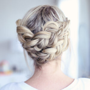 Close up view of young women standing in her room modeling "Crown Braid" hairstyle