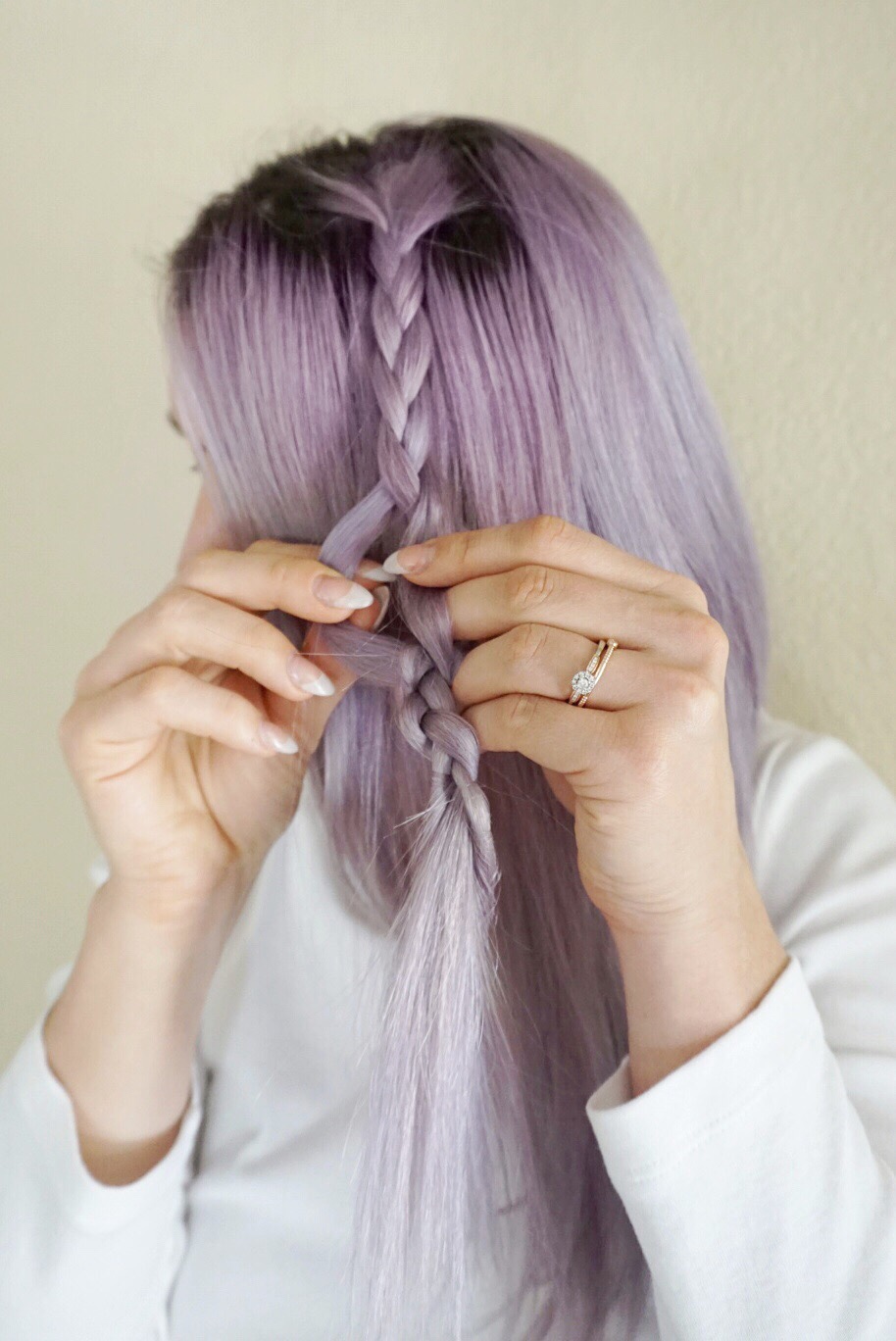 Close up of braid hair of little girl with colorful rubber bands