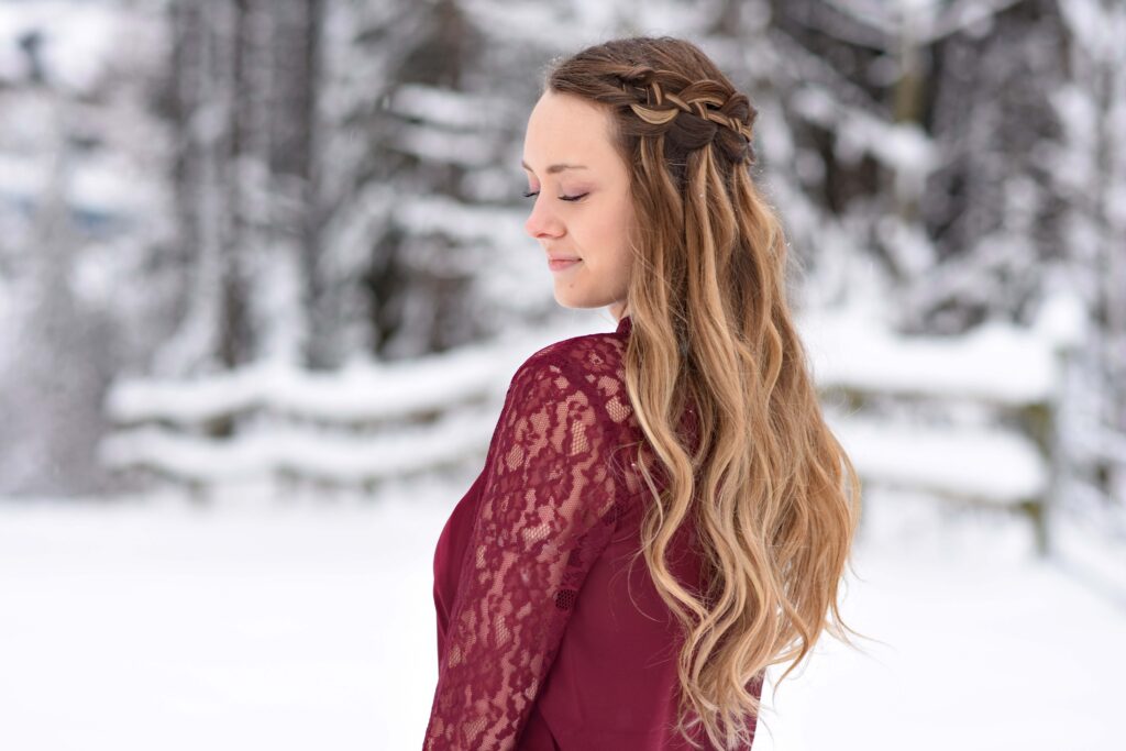 Side view of a girl wearing red shirt modeling "4 Strand Waterfall" hairstyle