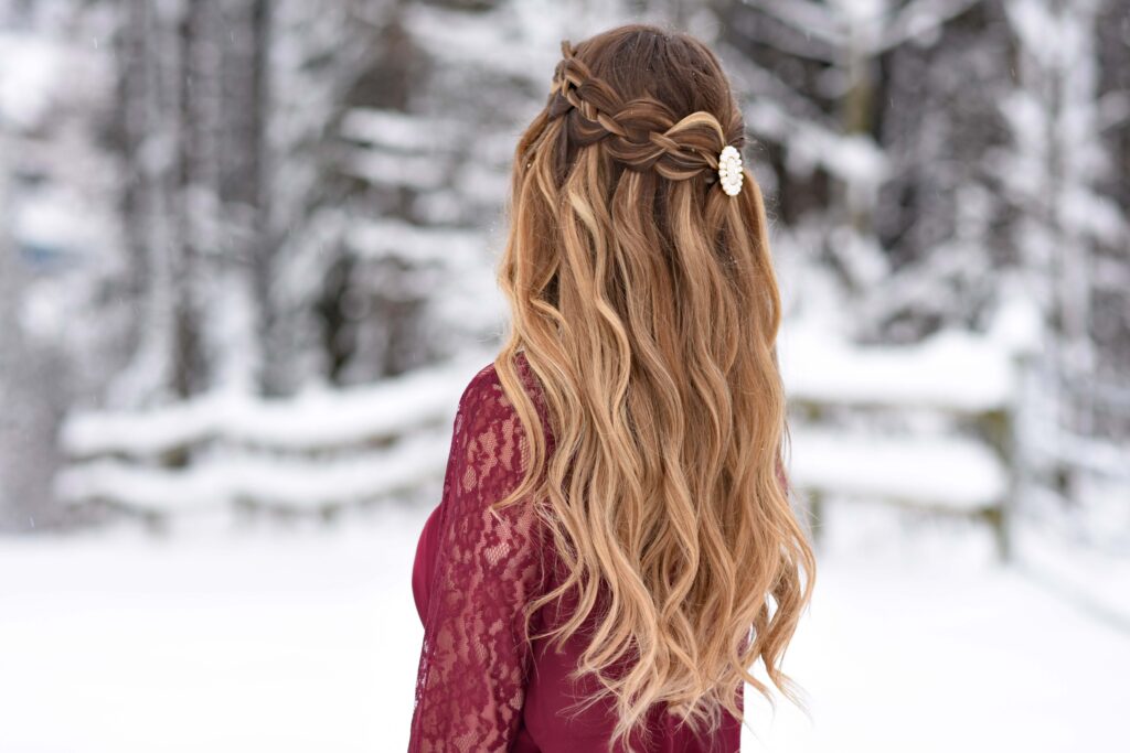 Back view of a girl wearing red shirt modeling "4 Strand Waterfall" hairstyle