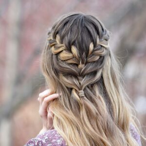 Back view of girl standing outside modeling the "Lace Half Up" hairstyle