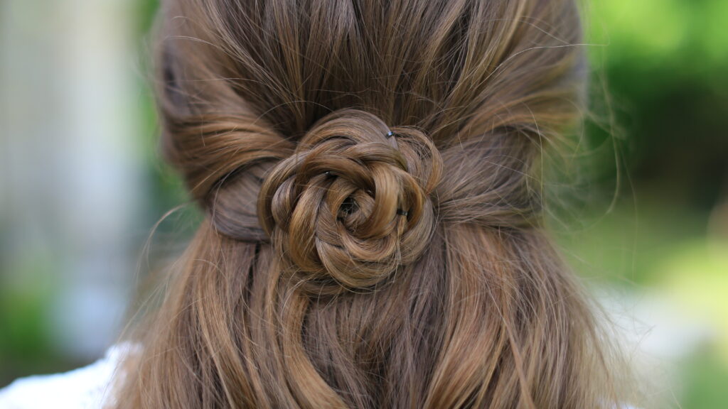 Close up of "Rosette Tieback" hairstyle