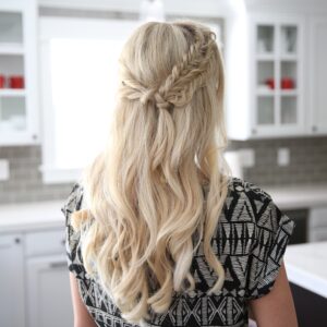 Back view of a blonde woman standing her kitchen modeling "Half Up Side Braid" hairstyle