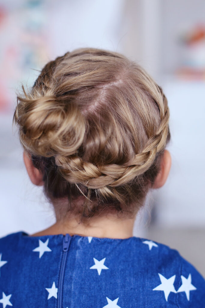 Close up back view of little girl modeling "Toddler Crown Braid" hairstyle